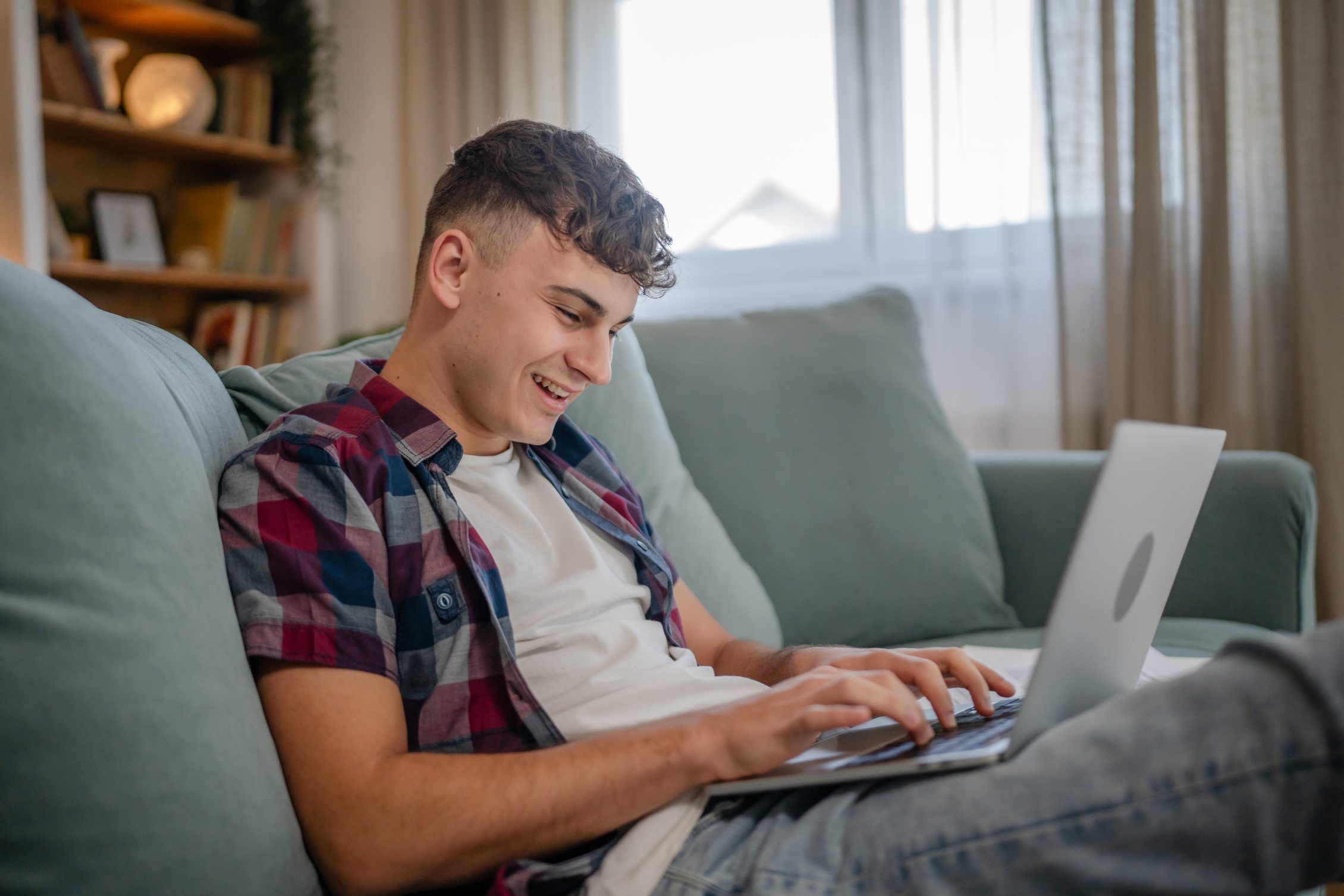 Young caucasian man teenager student study at home